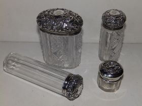 Three silver top cut glass dressing table jars - London 1895, the tallest 5.4" high and one