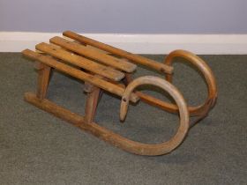 An old wooden sledge, 32.5" across.