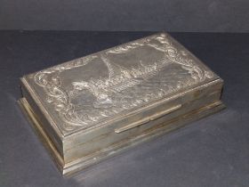 A Siamese 'Sterling' metal cigarette box, raised decoration to hinged cover showing a Siamese