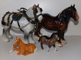 A Beswick grey shire mare, a brown shire mare and two small Beswick horses. (4)