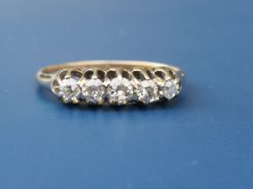 A small five stone old cut diamond ring on 18ct shank. Finger size M/N.