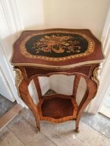 A marquetry inlaid two tier walnut occasional table of shaped form with gilt metal mounts, Height