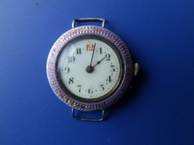 An early 20thC enamelled silver wrist watch, case diameter 30mm - no strap.