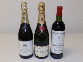 Two bottles of champagne - Reynier & Moet, together with a bottle of 1983 Mouton-Cadet Bordeaux. (