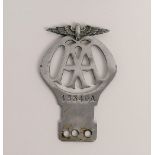 A chrome metal AA car badge, number 4334
