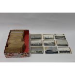 A collection of 150 postcards and photog