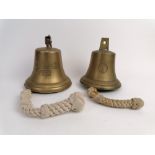 Two reproduction brass bells and clanger