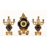 French porcelain and metal rococo style clock garniture with two train striking movement (358 9/22)