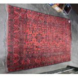 Fringed red patterned rug,