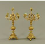 Pair of brass four branch candelabras,