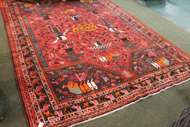 Large red patterned rug, cats, mice and possibly llamas, length 280 cm,