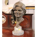 Meryl Evans, bust of a young lady (terracotta) raised on a marble base, overall height 47 cm.