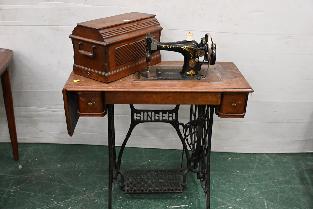 Singer sewing machine with treadle base