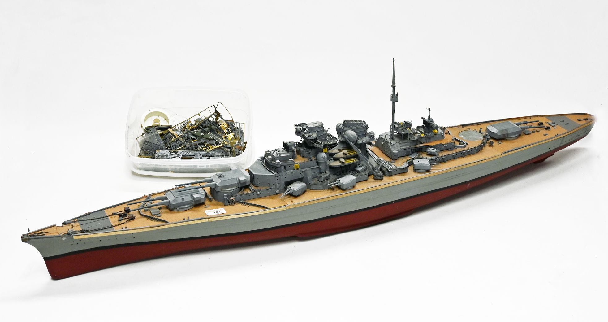 A well constructed kit built battleship in grey/red, with box of attachments, AF,