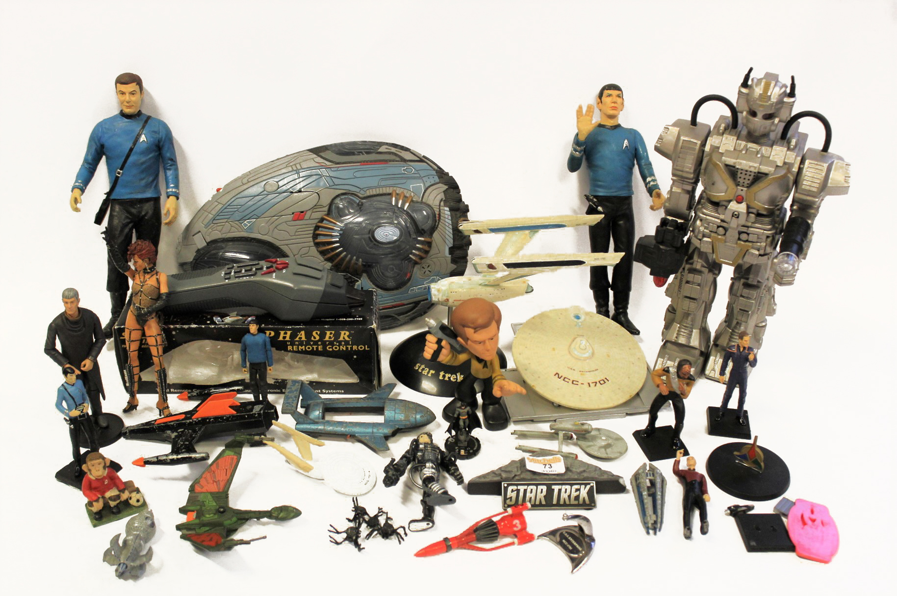 A box of assorted Star Trek and other space themed toys,