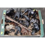 Carved hardwood elephants and other figures