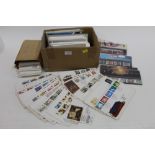 Box and file of First Day covers and Royal Mail stamp collections