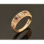 A ruby and diamond three stone ring, in 9 ct hallmarked gold setting.