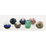 A collection of Caithness paperweights, to include the design Eng-Fish and Comet, seven in total,