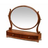 An Edwardian mahogany oval toilet mirror,