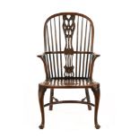 A Mahogany Windsor style armchair, with carved splat back,
