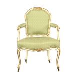 A 19th century French gilt and white painted open armchair, with upholstered back,