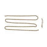 A gold coloured metal chain, snapped. The link clasp stamped 14 ct, 15.2 grams.