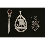 Three pieces of Scottish silver jewellery, including Shetland marked long boat,