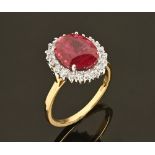 An 18 ct yellow gold fine Siamese ruby and diamond cluster ring, ruby +/- 4.34 carats.