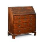 A George III oak bureau, with slope front and fitted interior,