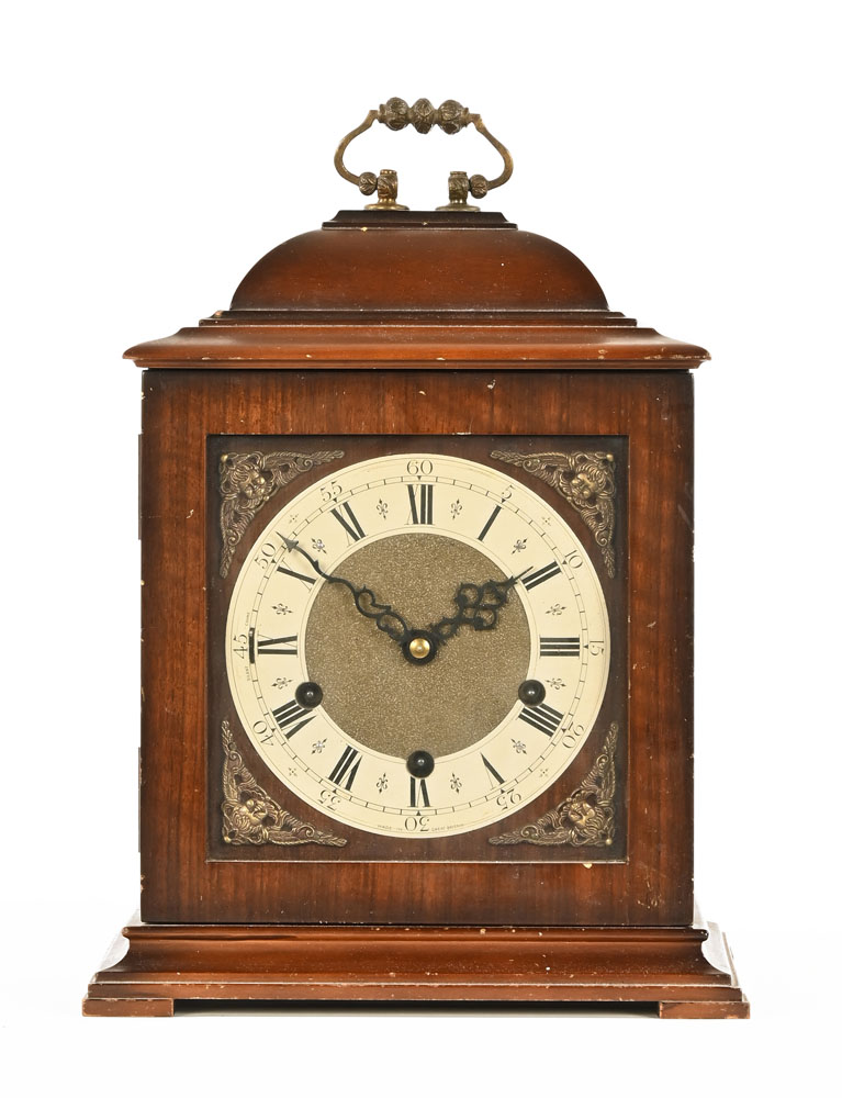 A mahogany cased Westminster chimes three train bracket clock in the Georgian style.