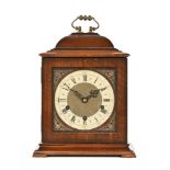 A mahogany cased Westminster chimes three train bracket clock in the Georgian style.