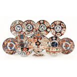 A collection of Japanese Imari porcelain, Meiji period, including nine different shaped dishes,
