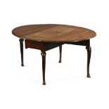 A mid 18th century mahogany drop leaf dining table,