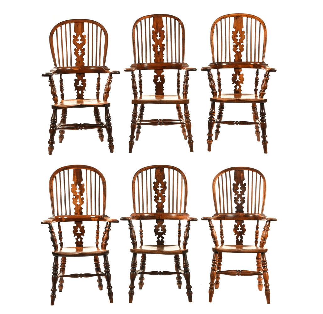 A good matched set of six 19th century yew wood broad arm Windsor chairs, with ash and elm seats.