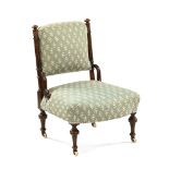 A Victorian walnut nursing chair,