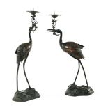A pair of Japanese bronze crane candle holders. Height 62 cm.