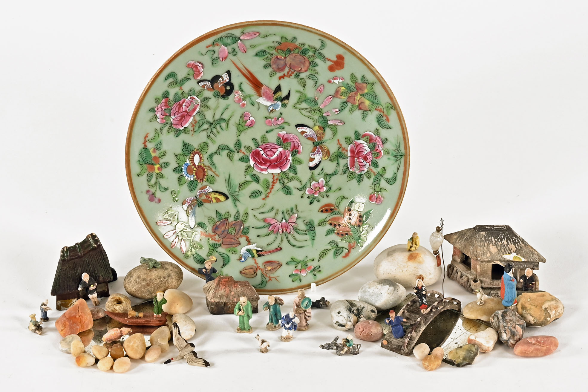 A collection of miniature Chinese garden ornaments, and a famille rose dish. Diameter 23 cm.