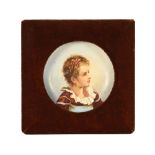 A small framed porcelain dish, continental, of a young girl in plush frame,