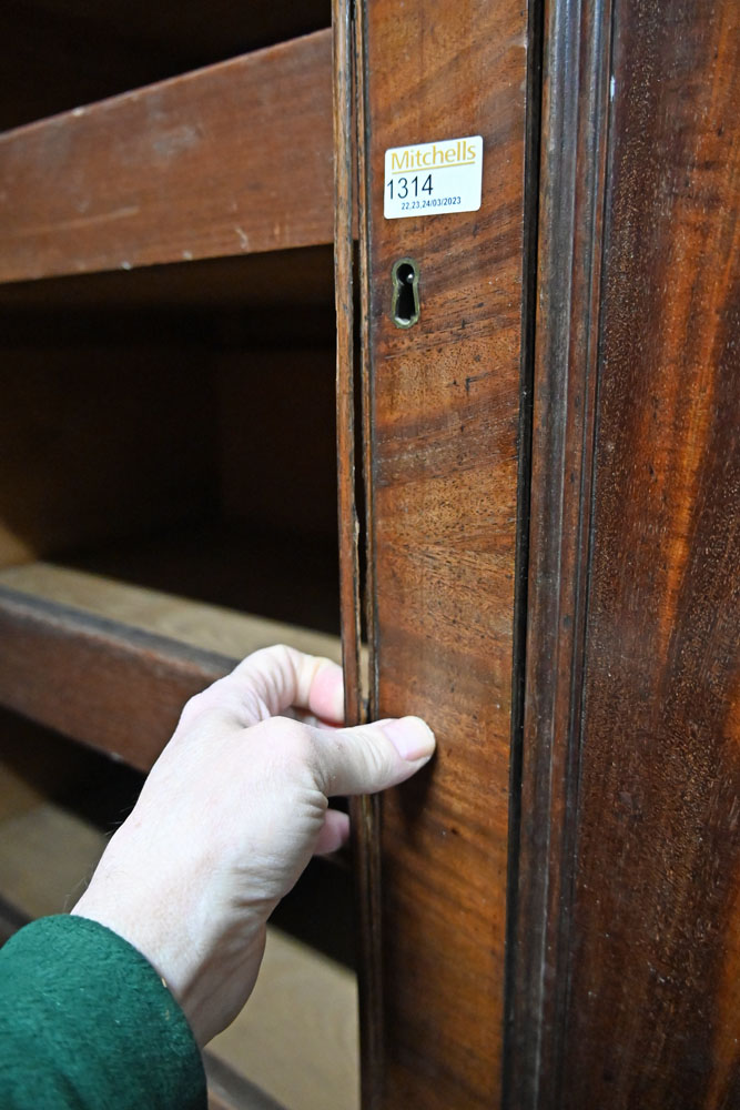 A William IV mahogany linen press with moulded cornice above a pair of panelled doors opening to - Image 5 of 12