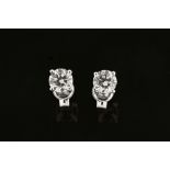 A pair of 18 ct white gold stud earrings, set with diamonds weighing +/- .84 carats.