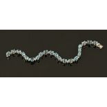 An 18 ct white gold aquamarine and diamond bracelet, aquamarine +/- 14 carats (see illustration).