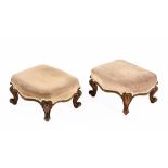 A pair of Victorian footstools, with stuffover tops and mahogany frames and raised on cabriole legs.