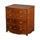 A Georgian mahogany and boxwood strung commode cabinet, in the form of a bowfronted chest,