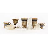 A pair of silver mounted Doulton Lambeth stoneware beakers, London mark for 1900, height 13 cm,