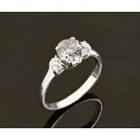 An 18 ct gold fancy diamond three stone ring. Size L.