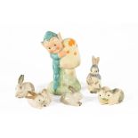 A Shelley Mabel Lucie Attwell pixie, height 8 cm, together with five Wade rabbits.