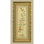 A Chinese silk picture, bird and flowers. 59 cm x 25 cm, framed.
