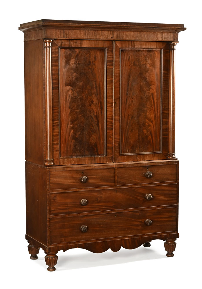 A William IV mahogany linen press with moulded cornice above a pair of panelled doors opening to