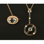 A 15 ct gold fine link chain, with aquamarine and seed pearl pendant,